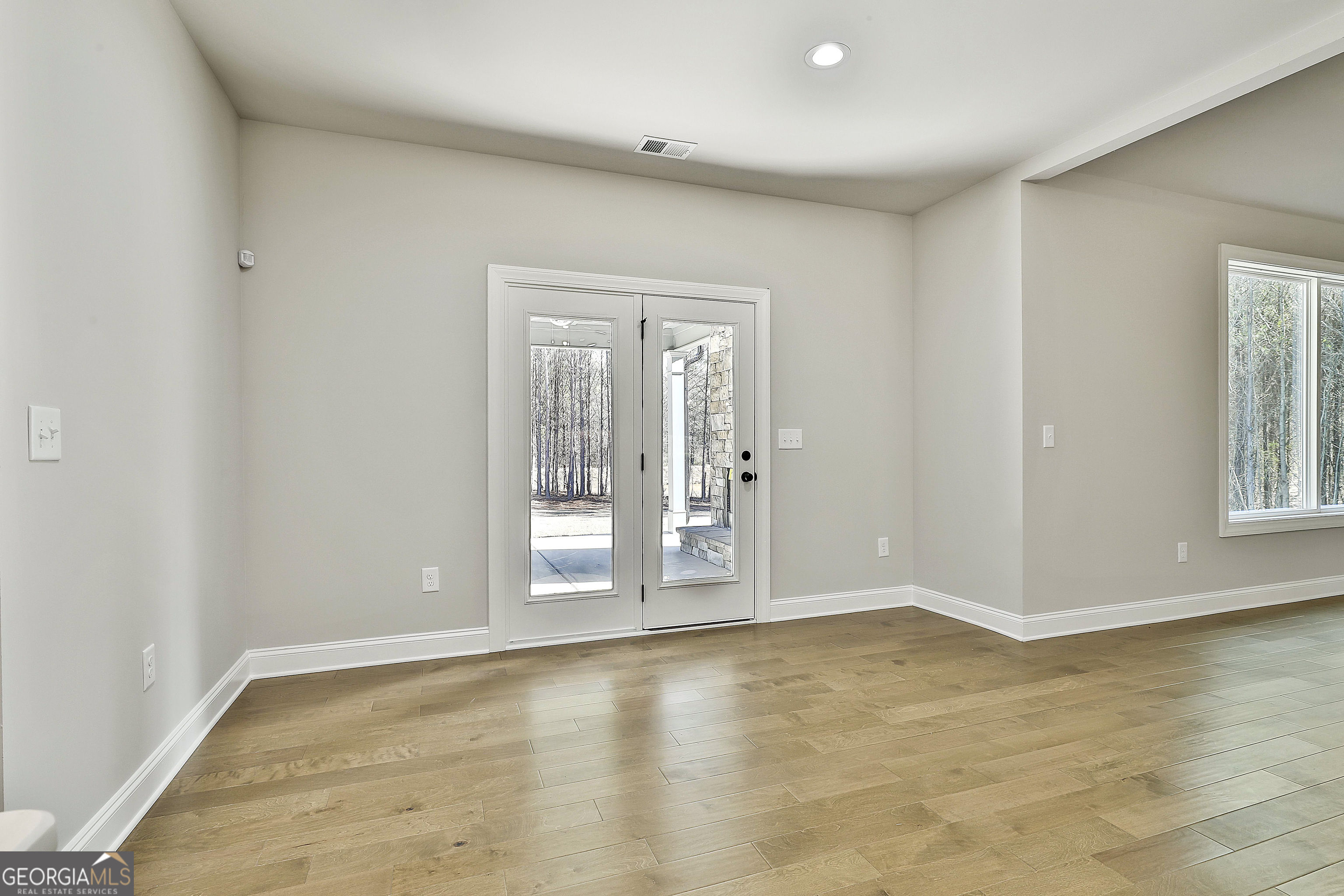 837 Alex Stephens Road Moreland, GA 30259 - Photo 25 of 50 wooden floor in an empty room with a window