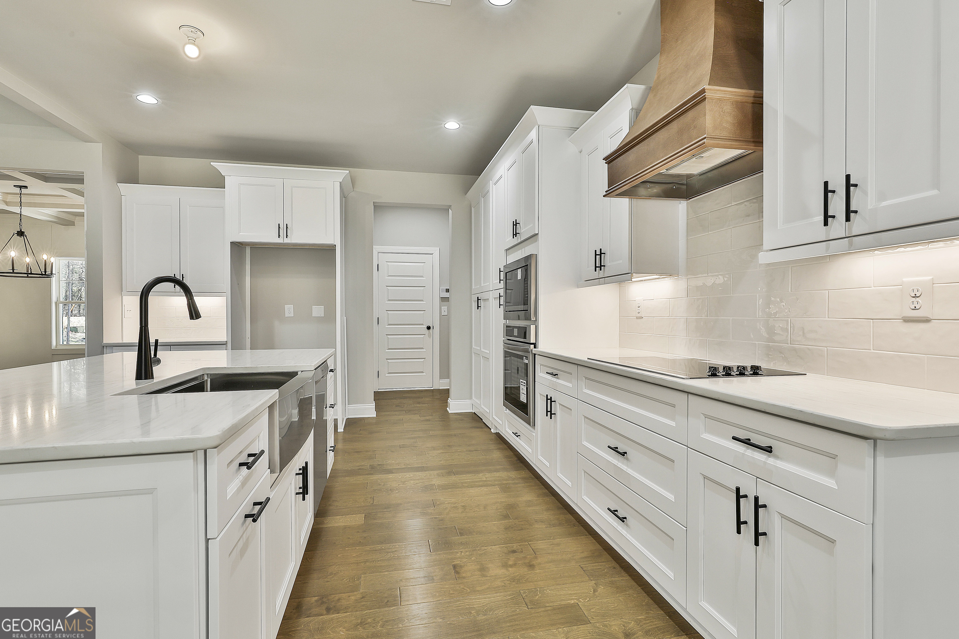 837 Alex Stephens Road Moreland, GA 30259 - Photo 28 of 50 a kitchen with stainless steel appliances a stove a sink and a refrigerator