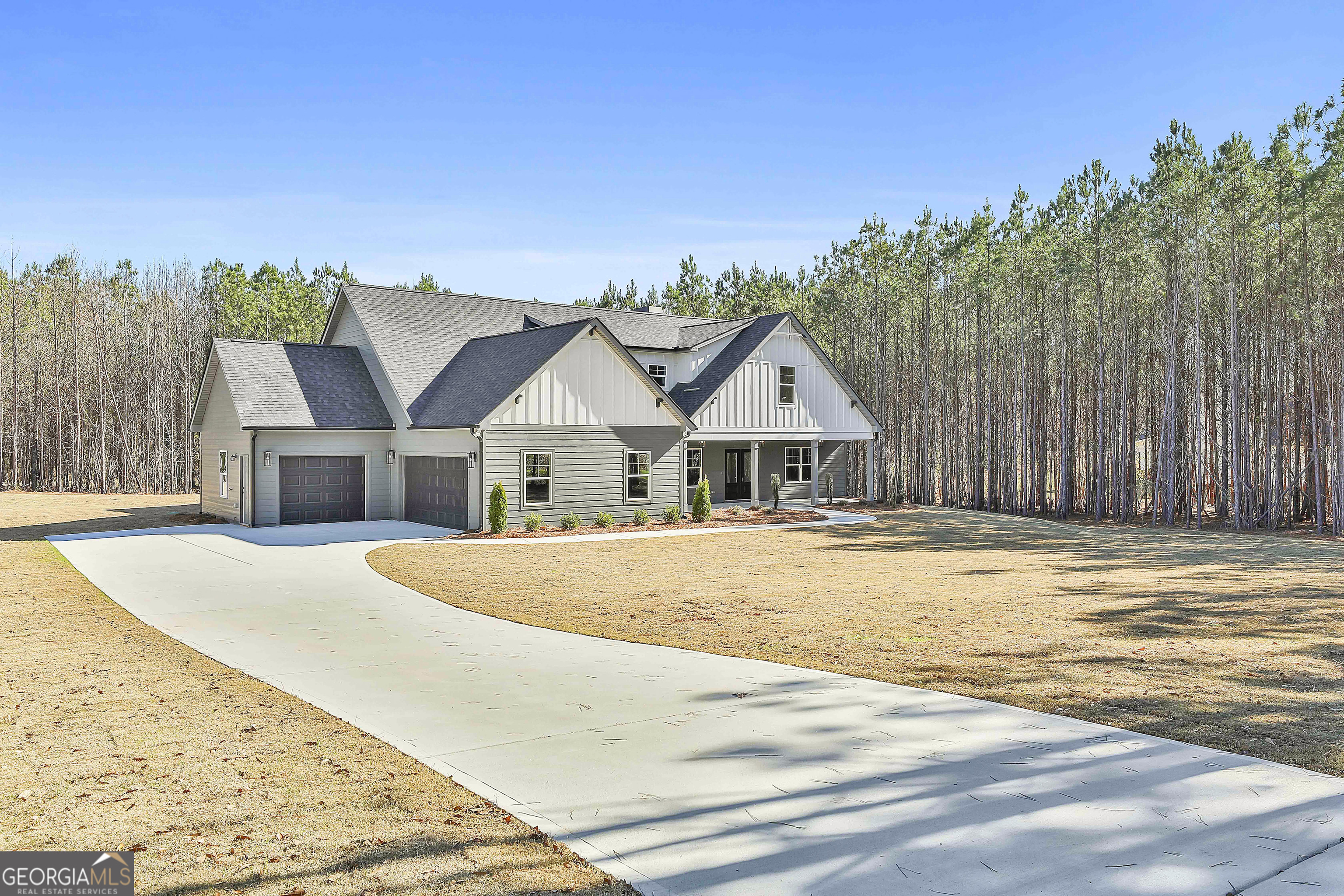 837 Alex Stephens Road Moreland, GA 30259 - Photo 3 of 50 a front view of a house with a yard and trees