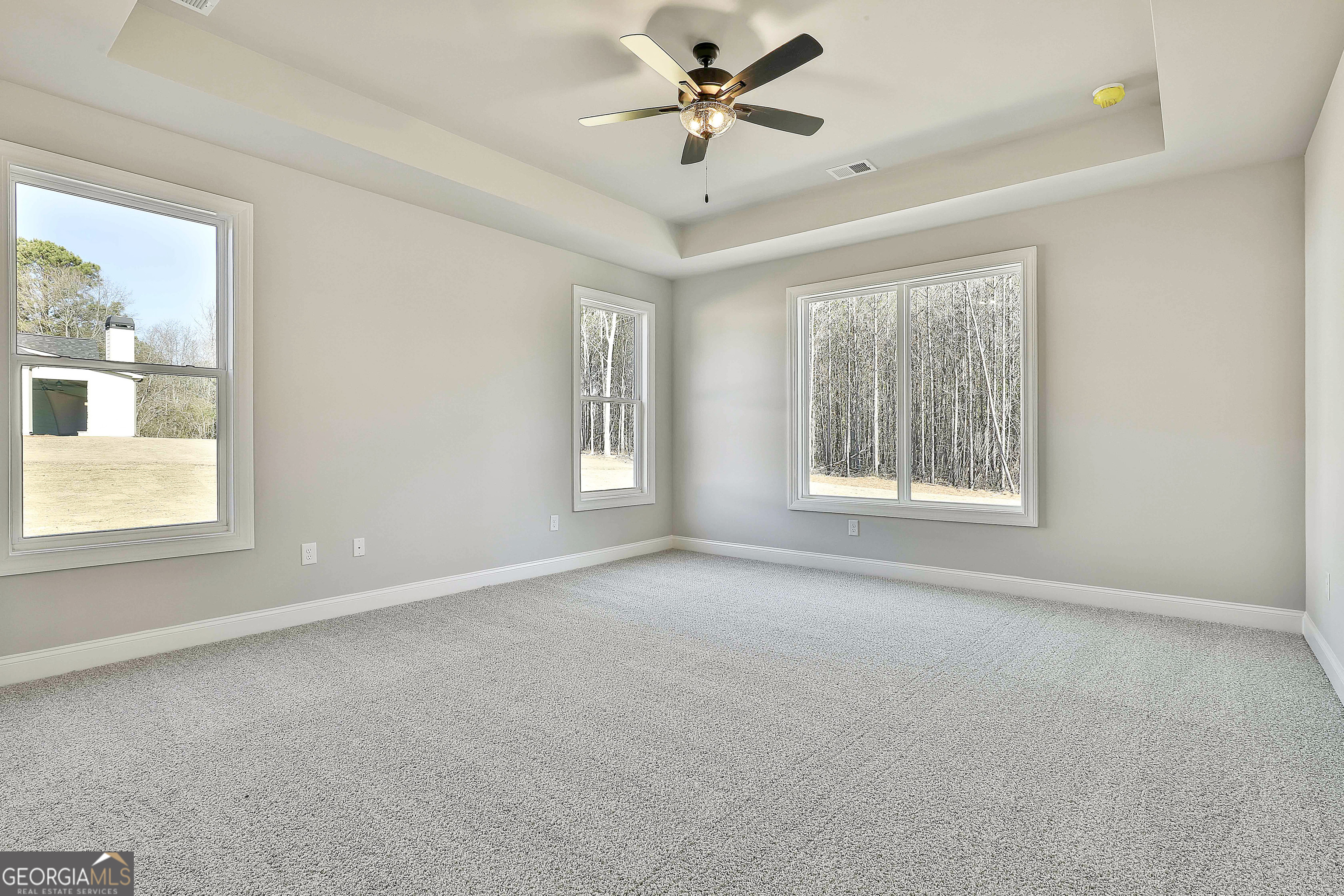 837 Alex Stephens Road Moreland, GA 30259 - Photo 34 of 50 an empty room with a window and a ceiling fan