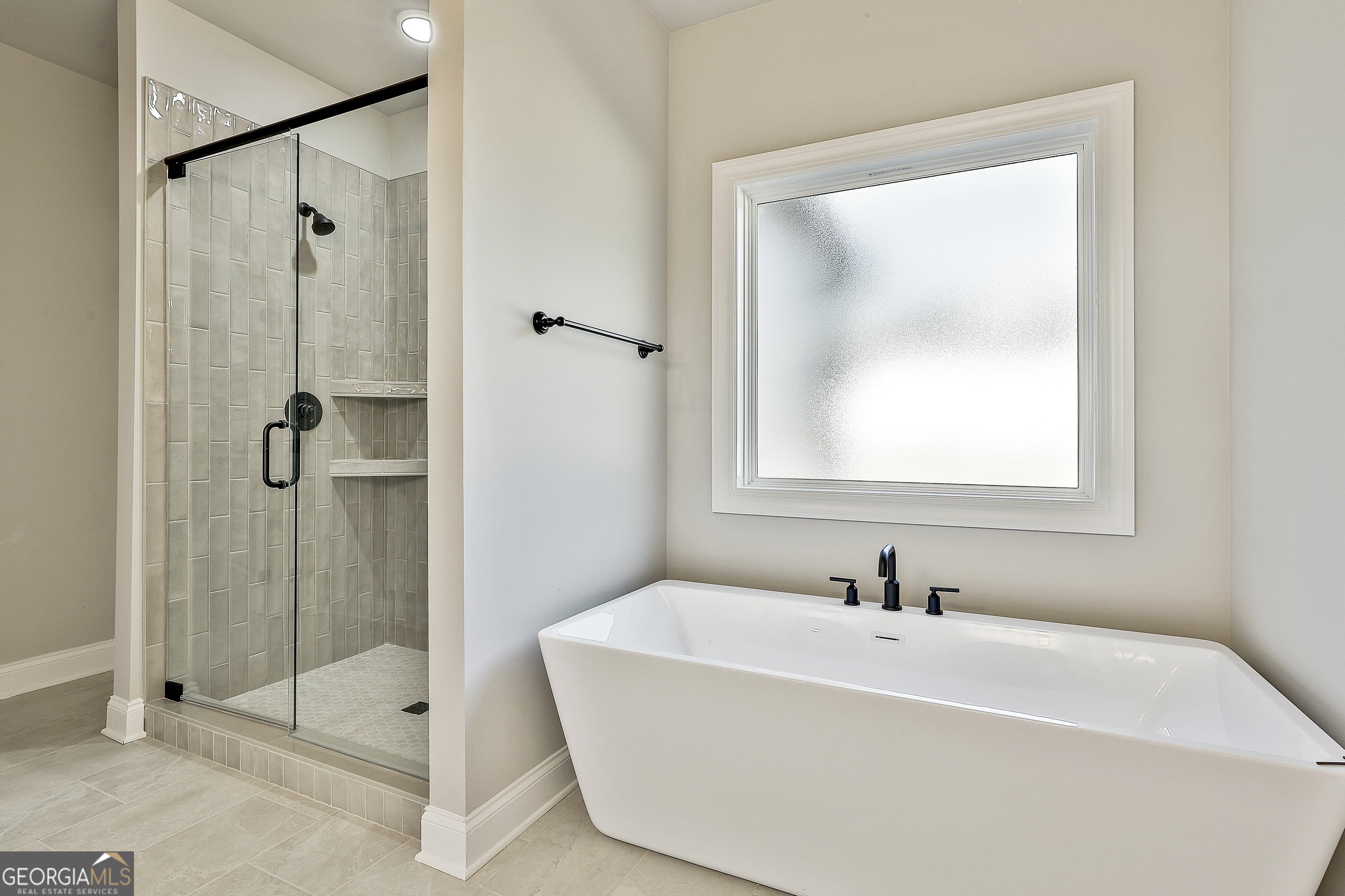 837 Alex Stephens Road Moreland, GA 30259 - Photo 37 of 50 a white bath tub sitting next to a bathroom