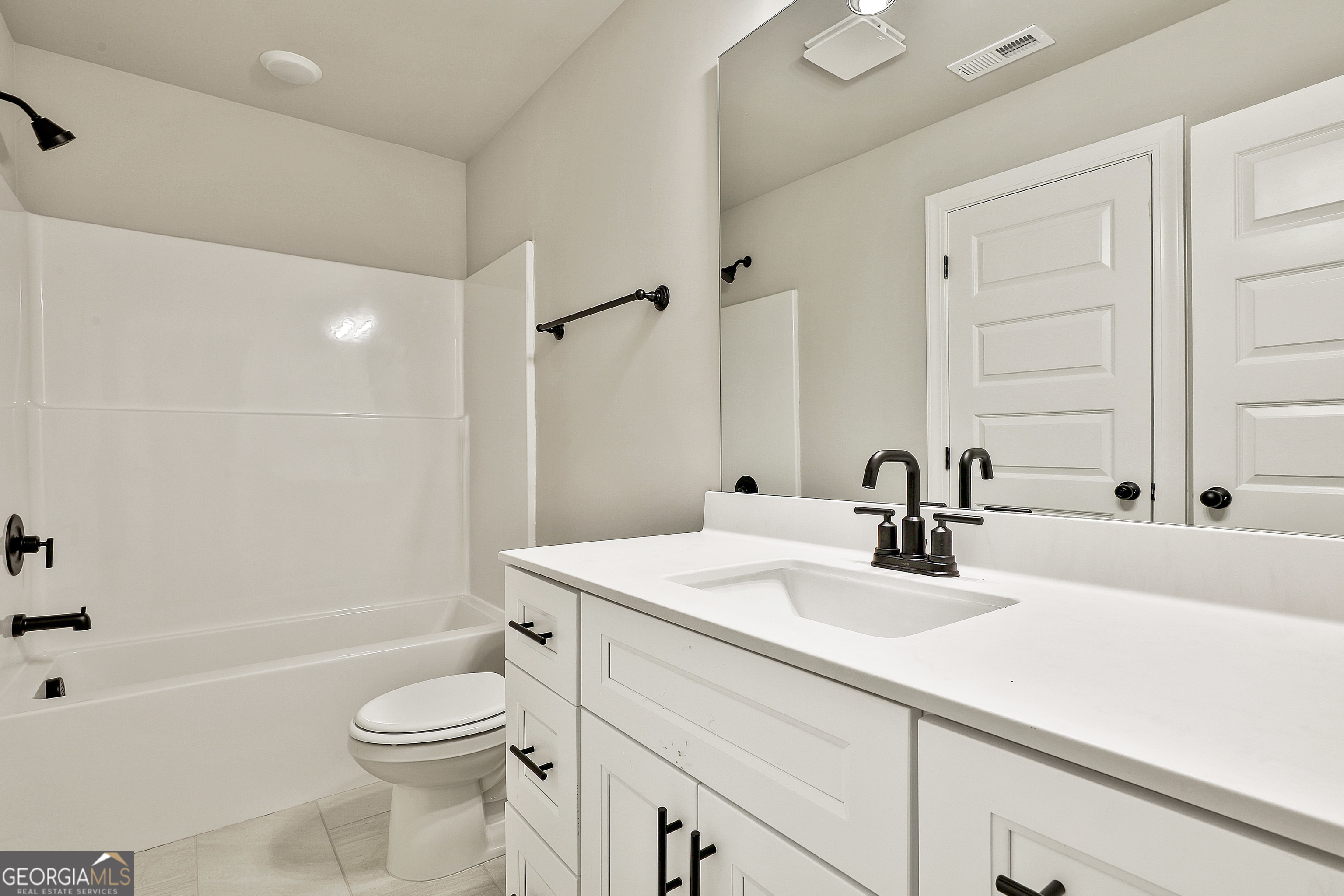 837 Alex Stephens Road Moreland, GA 30259 - Photo 43 of 50 a bathroom with a sink a toilet a tub and a shower