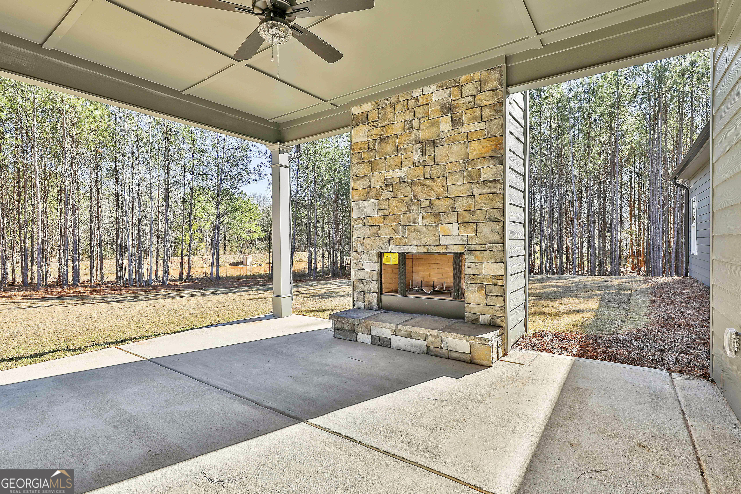 837 Alex Stephens Road Moreland, GA 30259 - Photo 45 of 50 a living room with a fireplace furniture and a floor to ceiling window