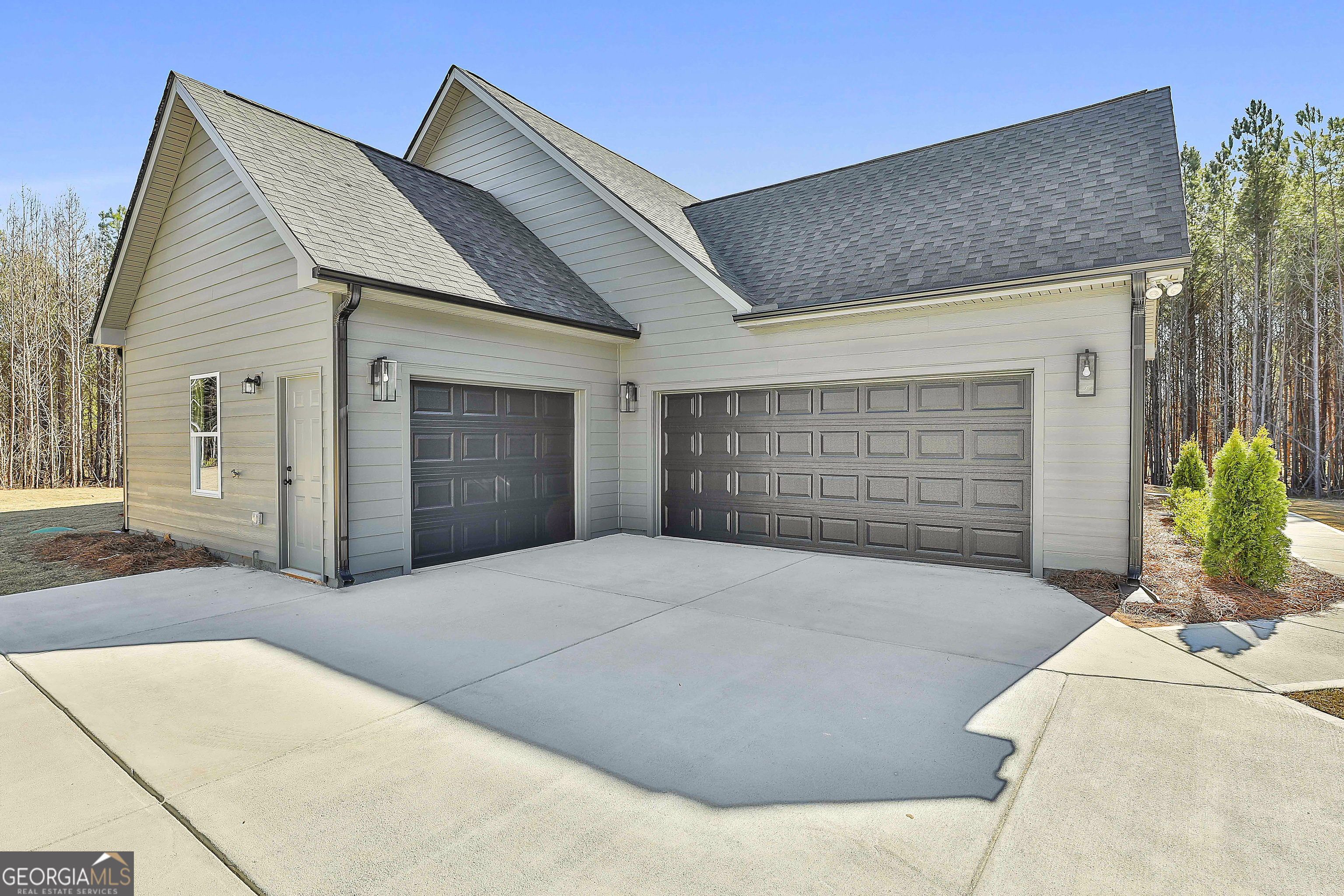 837 Alex Stephens Road Moreland, GA 30259 - Photo 6 of 50 a front view of a house with a garage