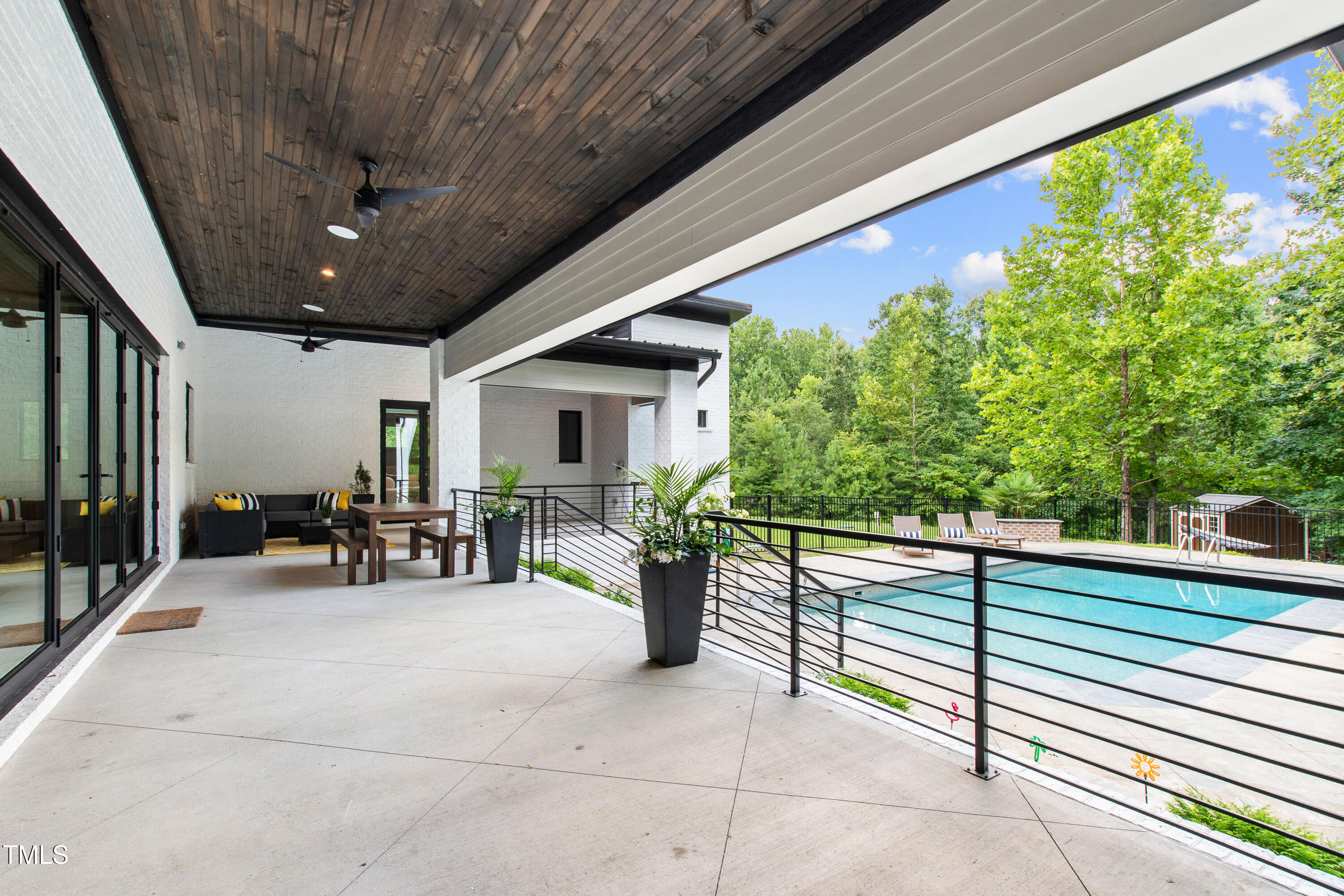 12912 Creedmoor Road Wake Forest, NC 27587 - Photo 33 of 43 Large covered Veranda with integrated speakers and Sonos system - ideal for dinner party playlists, listening to the game, or soothing classical while reading a book!
