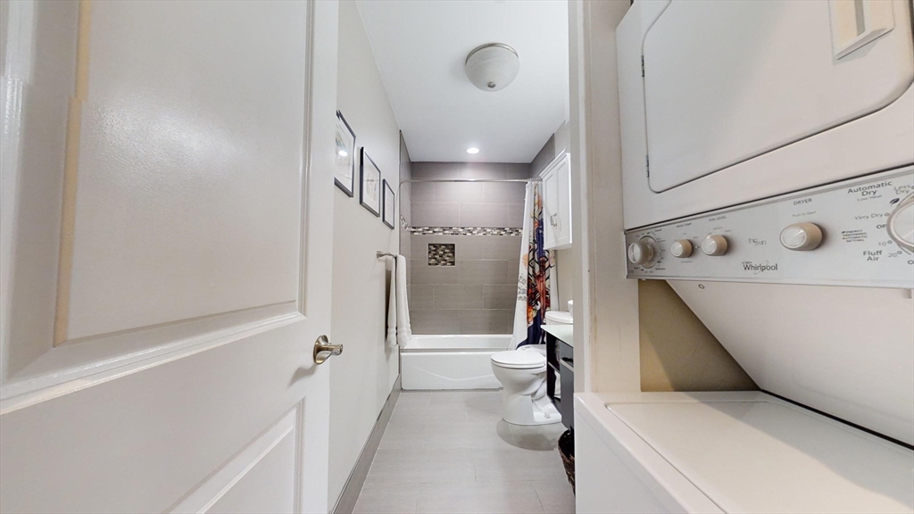 42 Olney Street, Unit 1R Boston, MA 02121 - Photo 11 of 21 a bathroom with a bathtub and a shower