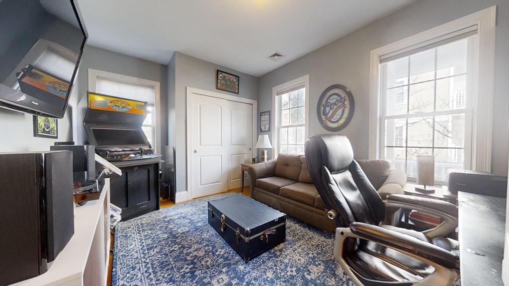 42 Olney Street, Unit 1R Boston, MA 02121 - Photo 12 of 21 a living room with furniture and a window