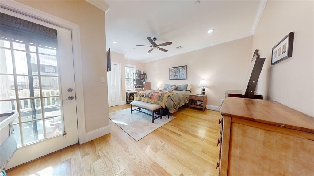 42 Olney Street, Unit 1R Boston, MA 02121 - Photo 15 of 21 a bedroom with furniture and a large window