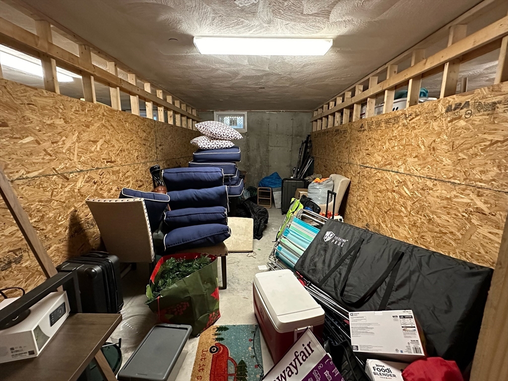 42 Olney Street, Unit 1R Boston, MA 02121 - Photo 18 of 21 a couch sitting in a room next to a window