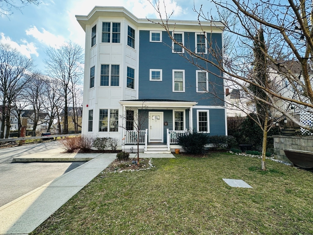 42 Olney Street, Unit 1R Boston, MA 02121 - Photo 2 of 21 a front view of a house with a yard