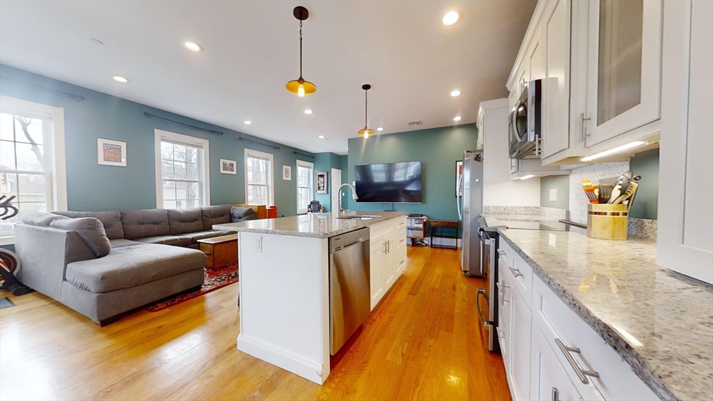 42 Olney Street, Unit 1R Boston, MA 02121 - Photo 3 of 21 a large kitchen with stainless steel appliances lots of counter space