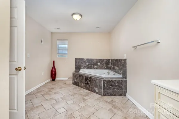 a bathroom with a bathtub and a sink