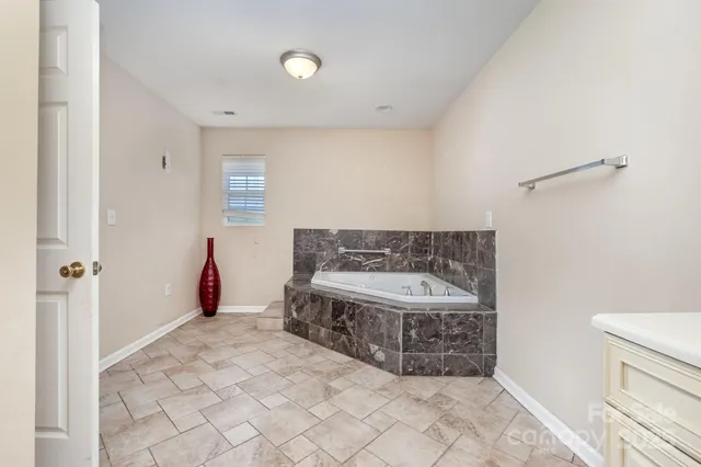 a bathroom with a bathtub and a sink