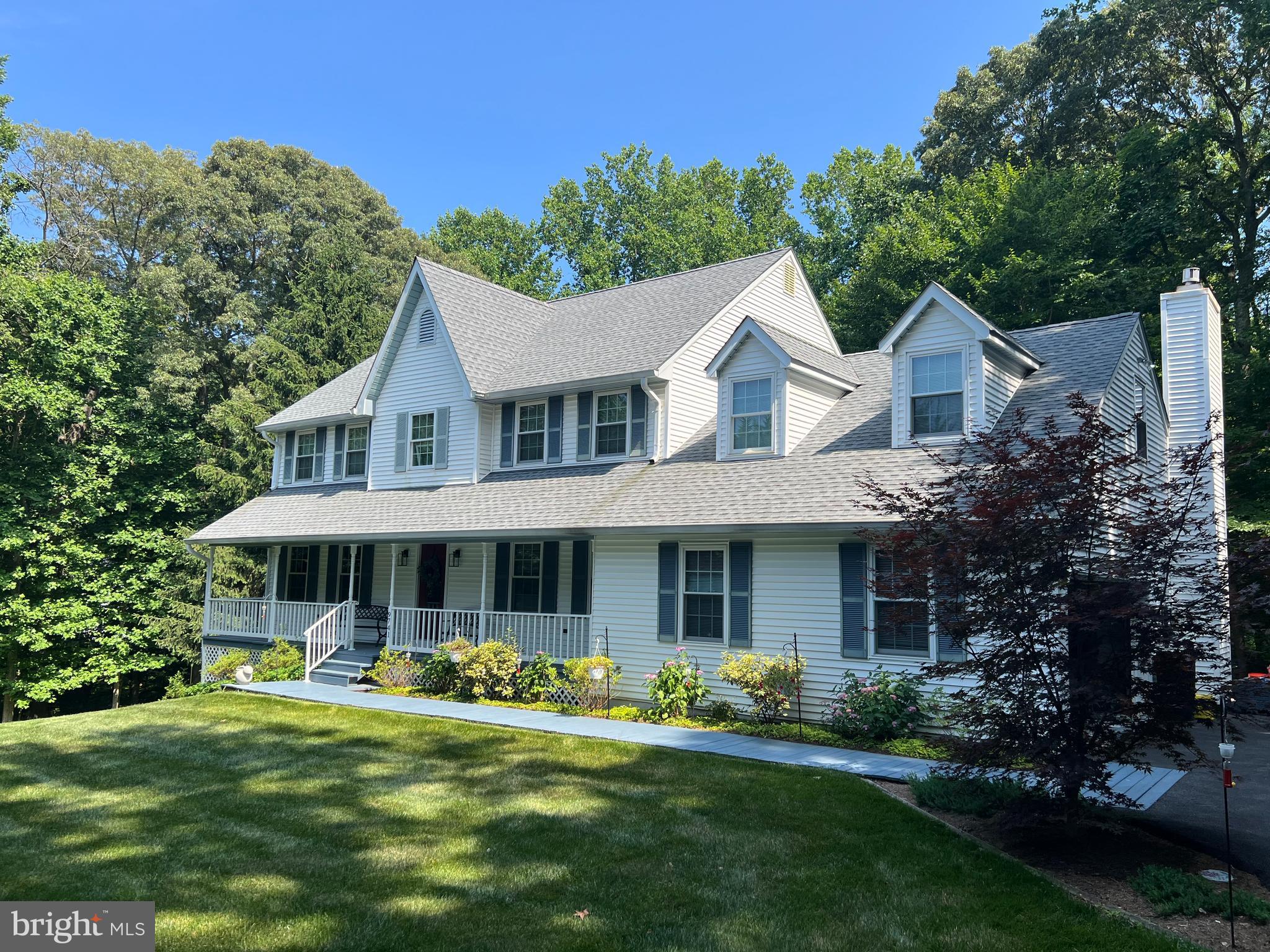 9741 Howes Road Dunkirk, MD 20754 - Photo 1 of 48 a front view of a house with a garden