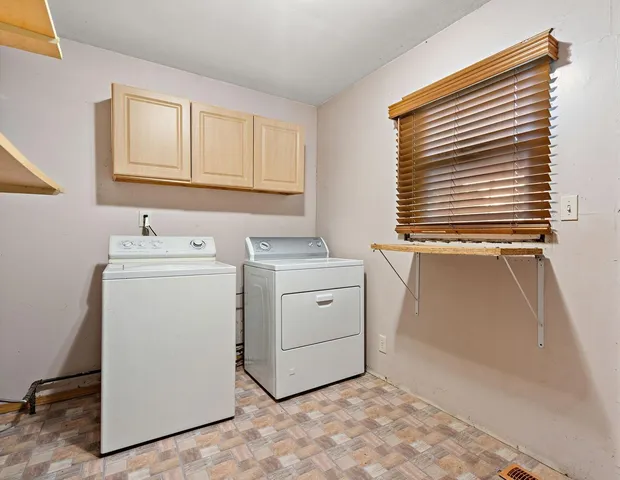 a utility room with closet dryer and washer