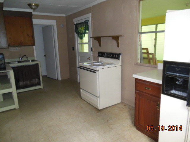 8644 Briery Branch Road Dayton, VA 22821 - Photo 6 of 10 a kitchen with a stove and a refrigerator