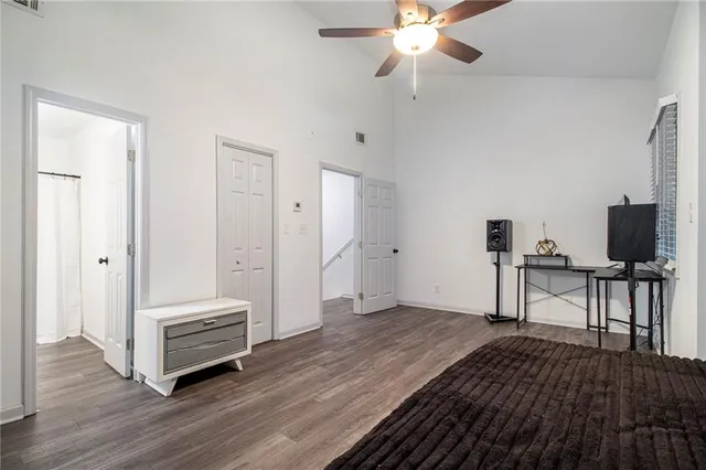 a view of a hallway with wooden floor
