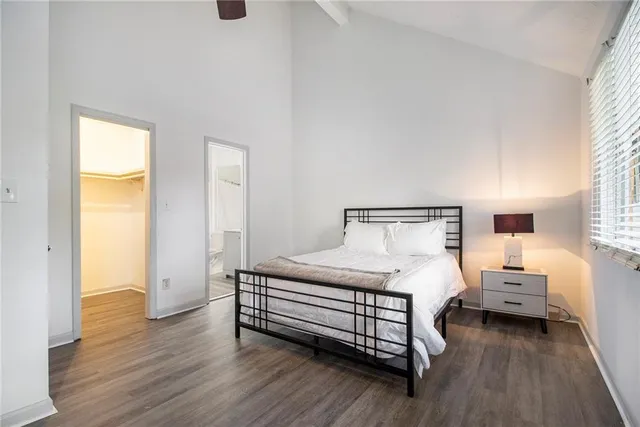 a bedroom with a bed and a chair