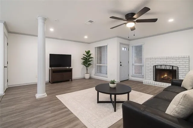 a living room with furniture and a fireplace