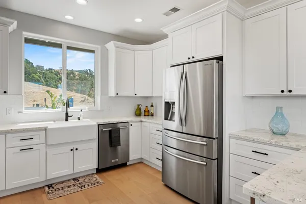 a kitchen with a sink and a window