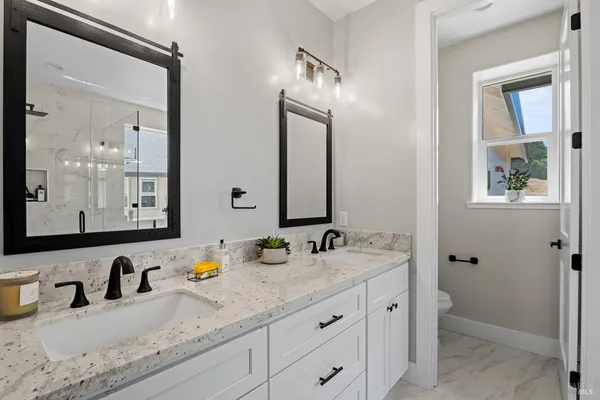 a bathroom with sink and mirror