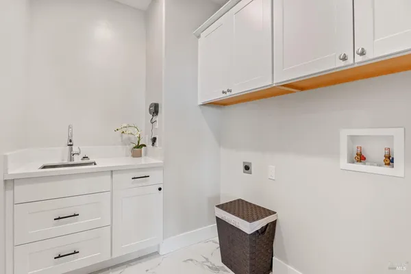a bathroom with a granite countertop sink a toilet and shower