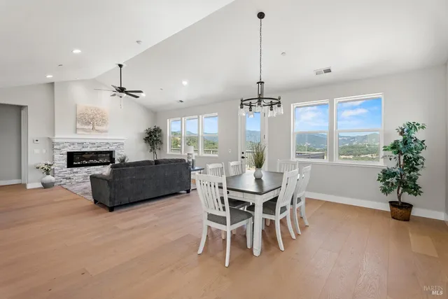 a living room with furniture a window and a chandelier