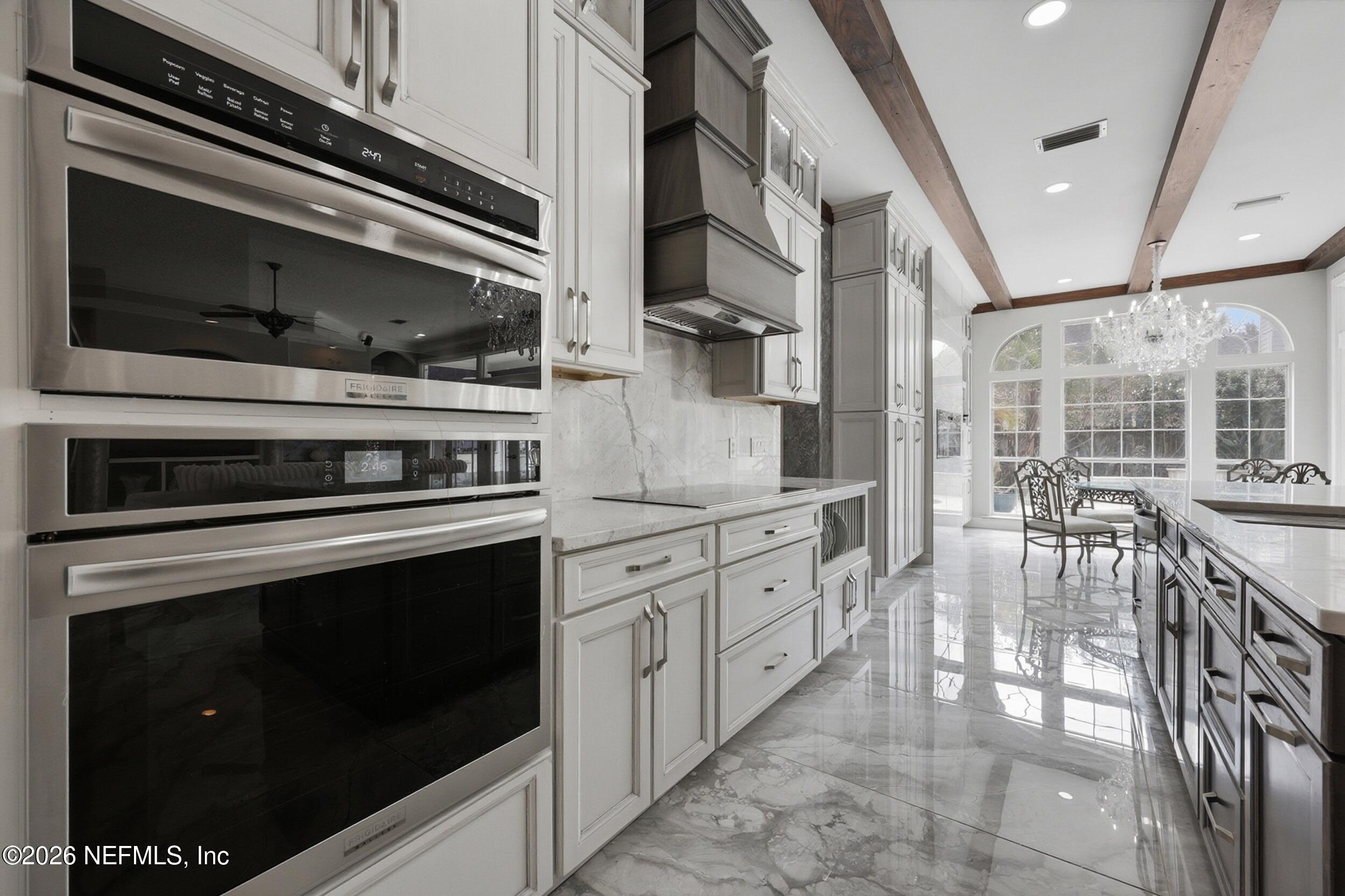 40 Tallwood Road Jacksonville Beach, FL 32250 - Photo 16 of 75 a kitchen with granite countertop a stove and a microwave
