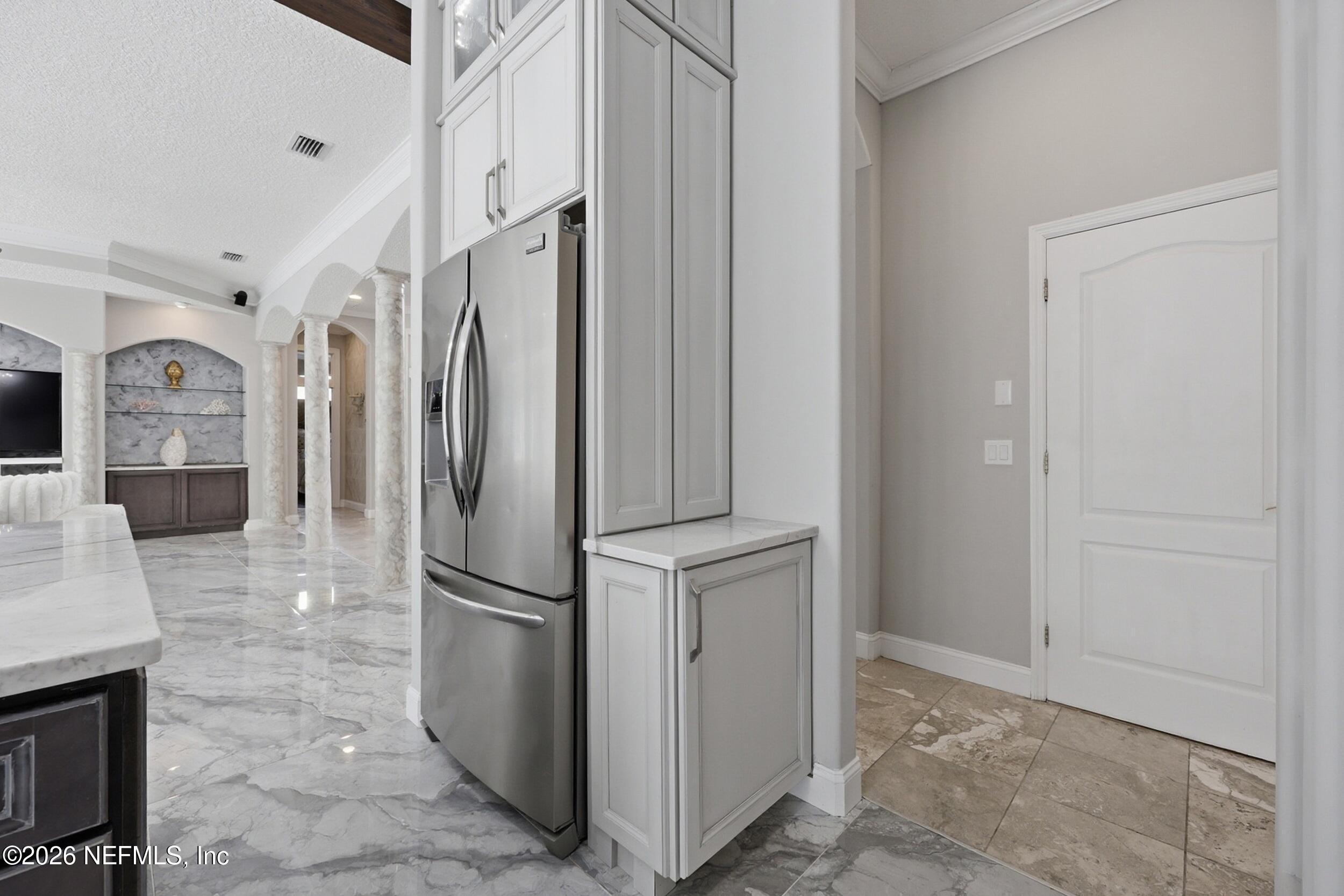 40 Tallwood Road Jacksonville Beach, FL 32250 - Photo 18 of 75 a kitchen with stainless steel appliances granite countertop a refrigerator and a sink