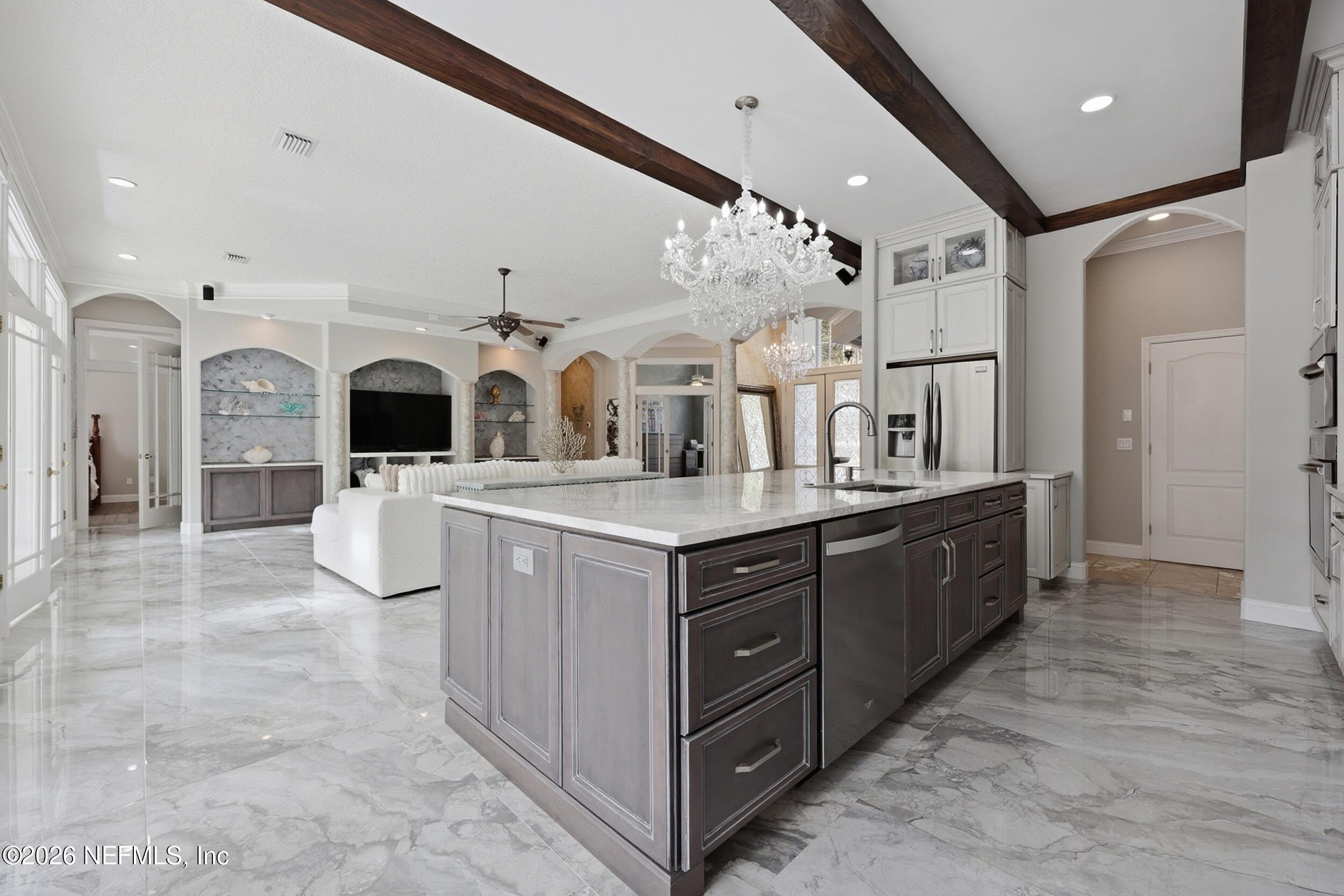 40 Tallwood Road Jacksonville Beach, FL 32250 - Photo 20 of 75 a large white kitchen with stainless steel appliances granite countertop a stove and a sink