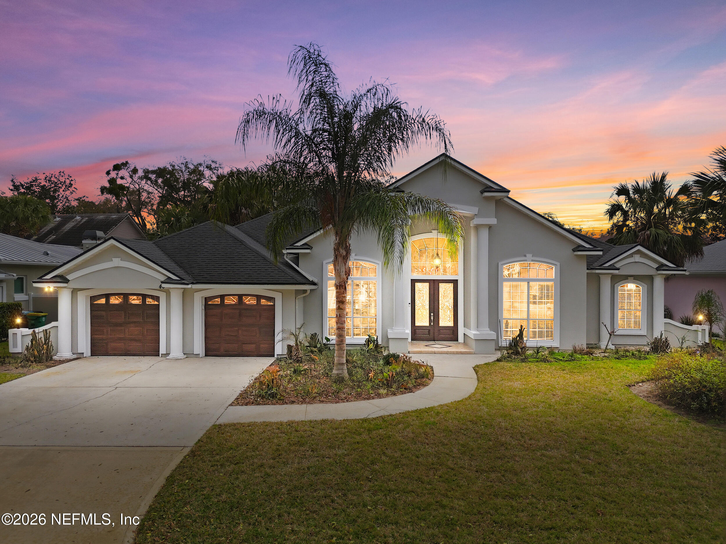 40 Tallwood Road Jacksonville Beach, FL 32250 - Photo 2 of 75 a front view of a house with a yard and trees