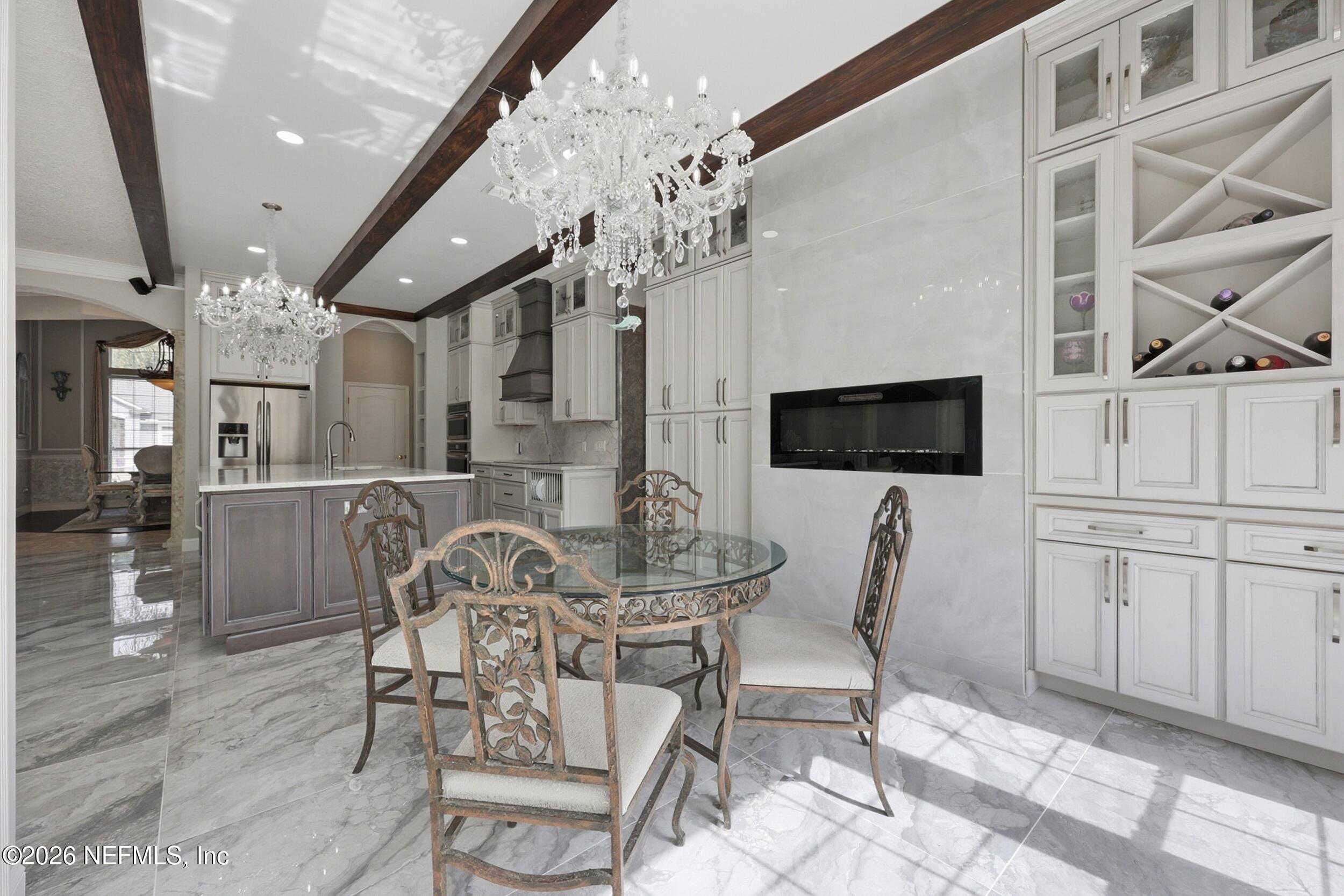 40 Tallwood Road Jacksonville Beach, FL 32250 - Photo 23 of 75 a view of a dining room with furniture and wooden floor