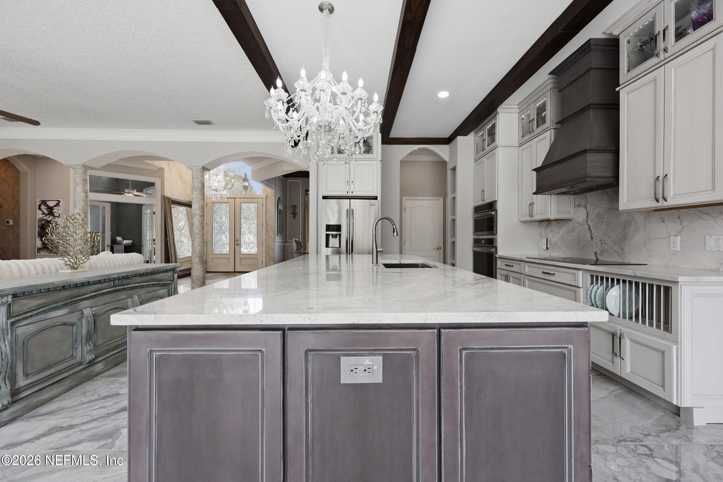 40 Tallwood Road Jacksonville Beach, FL 32250 - Photo 24 of 75 a kitchen with stainless steel appliances granite countertop a sink and a refrigerator