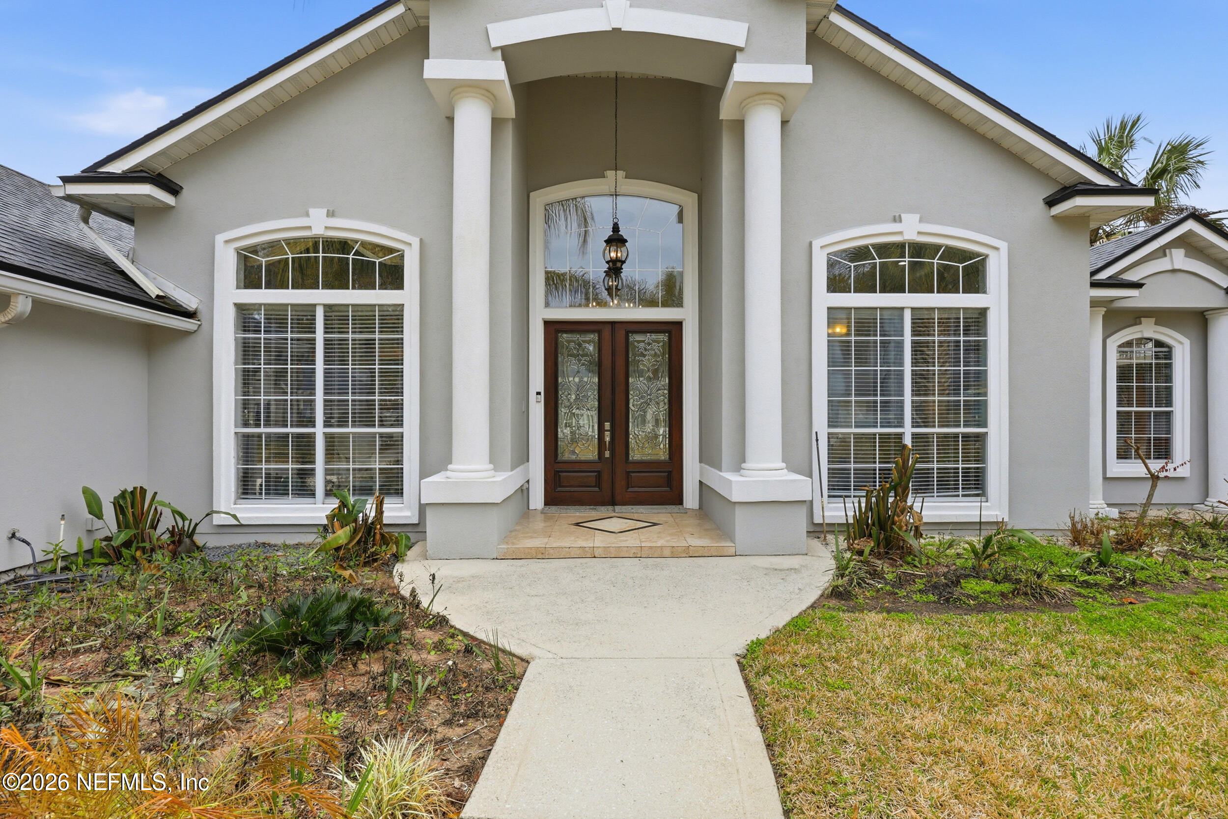 40 Tallwood Road Jacksonville Beach, FL 32250 - Photo 3 of 75 a front view of a house with a yard