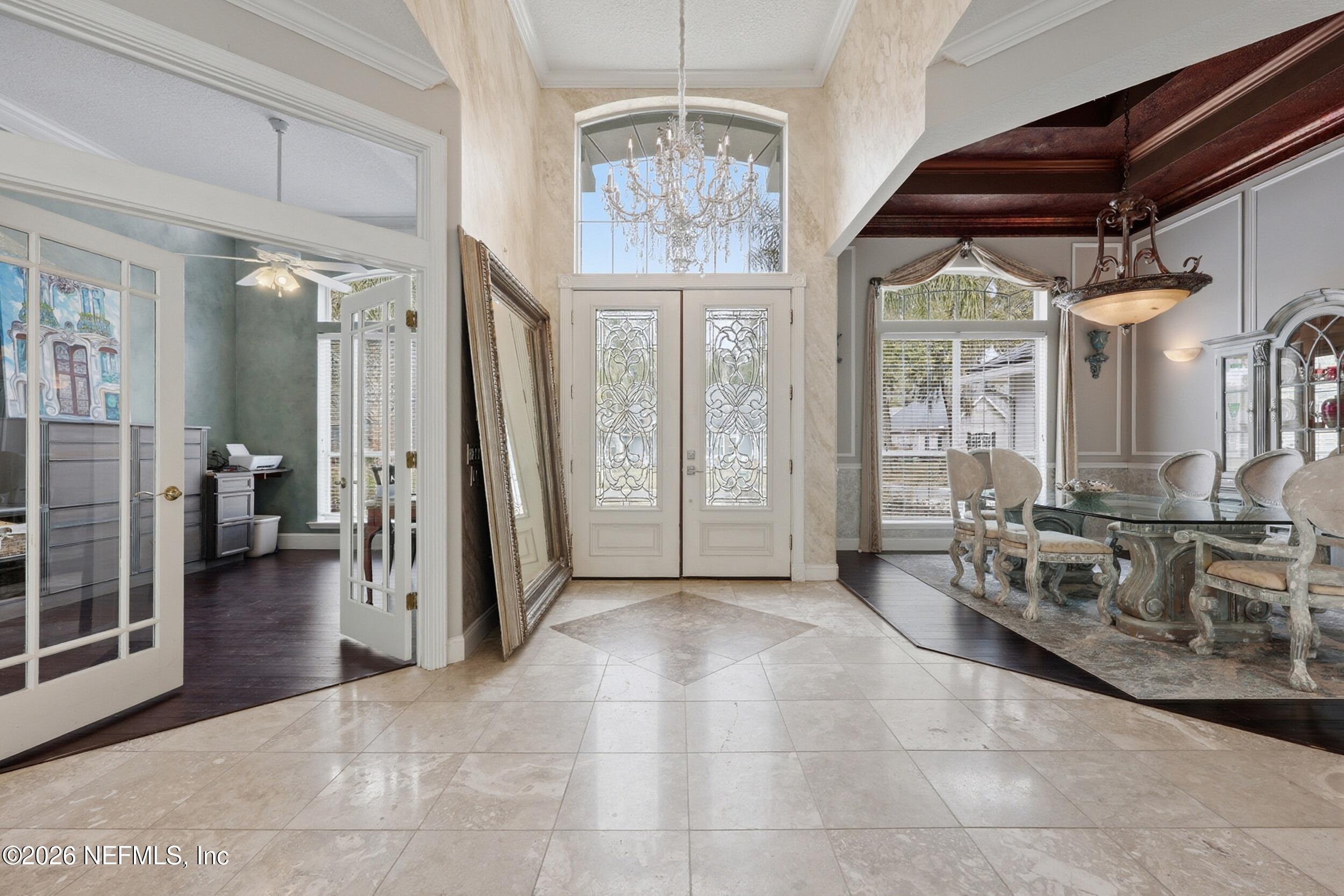 40 Tallwood Road Jacksonville Beach, FL 32250 - Photo 4 of 75 a view of a hallway with furniture and a chandelier