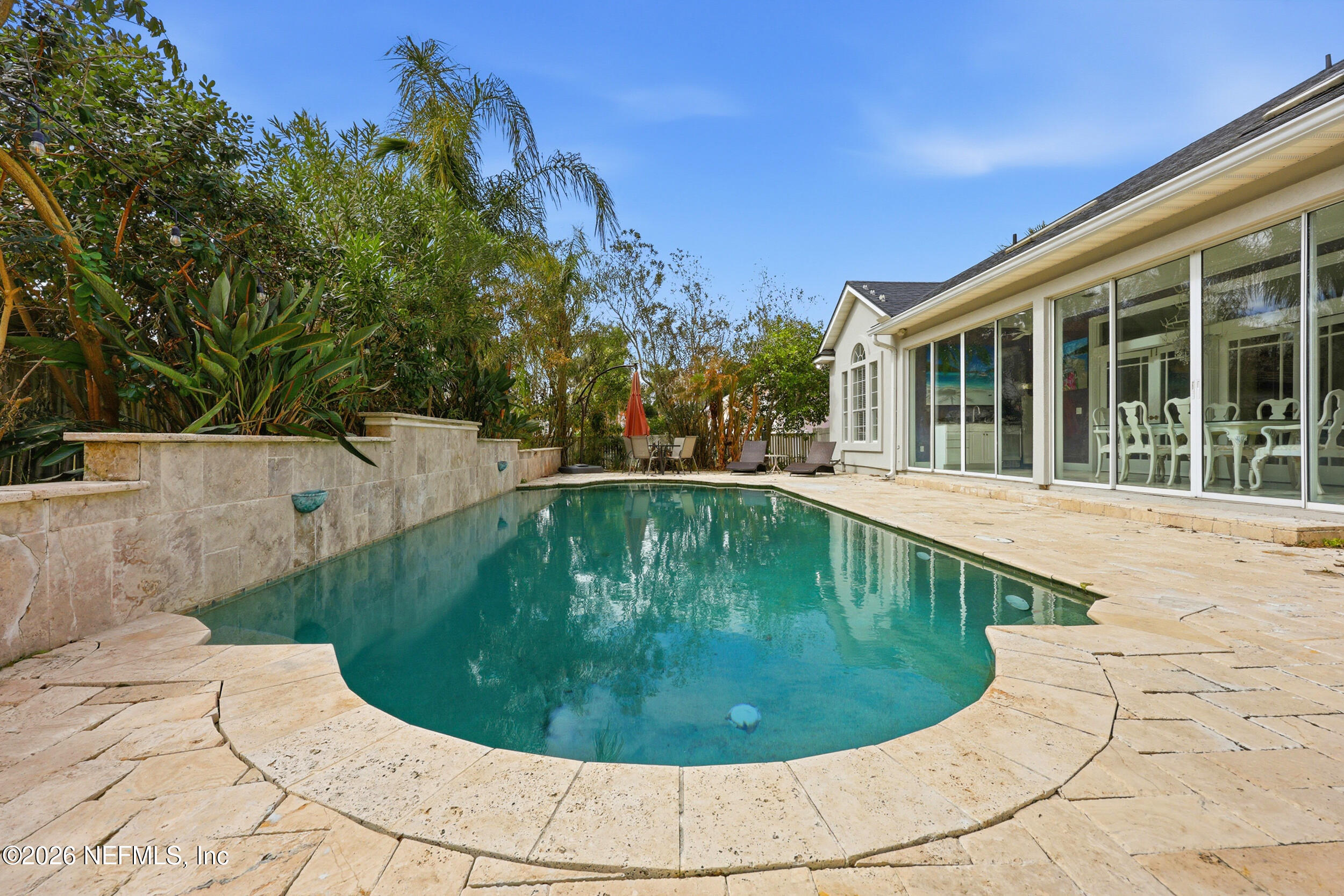 40 Tallwood Road Jacksonville Beach, FL 32250 - Photo 55 of 75 a view of a swimming pool with a sitting area