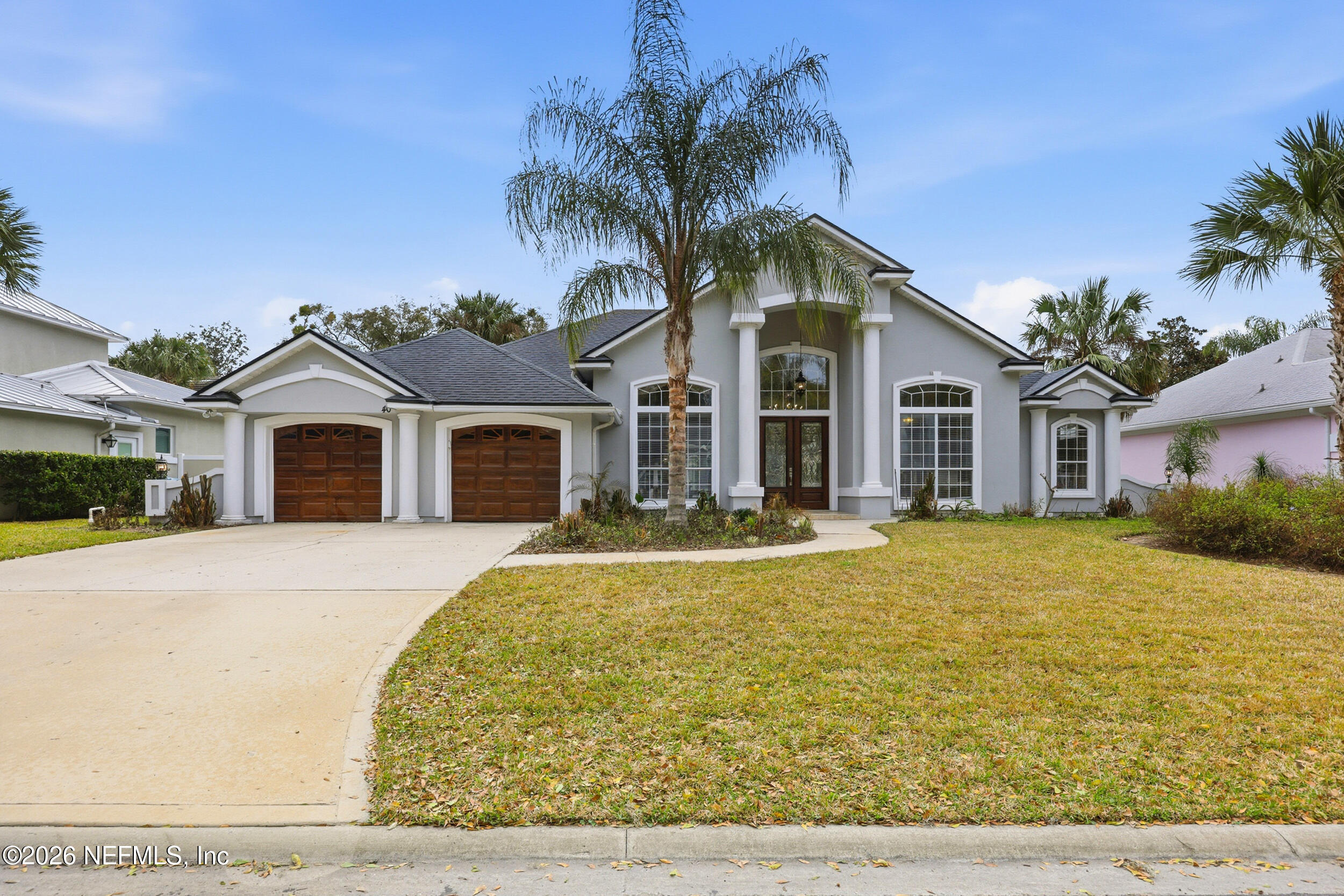 40 Tallwood Road Jacksonville Beach, FL 32250 - Photo 63 of 75 a front view of a house with a garden