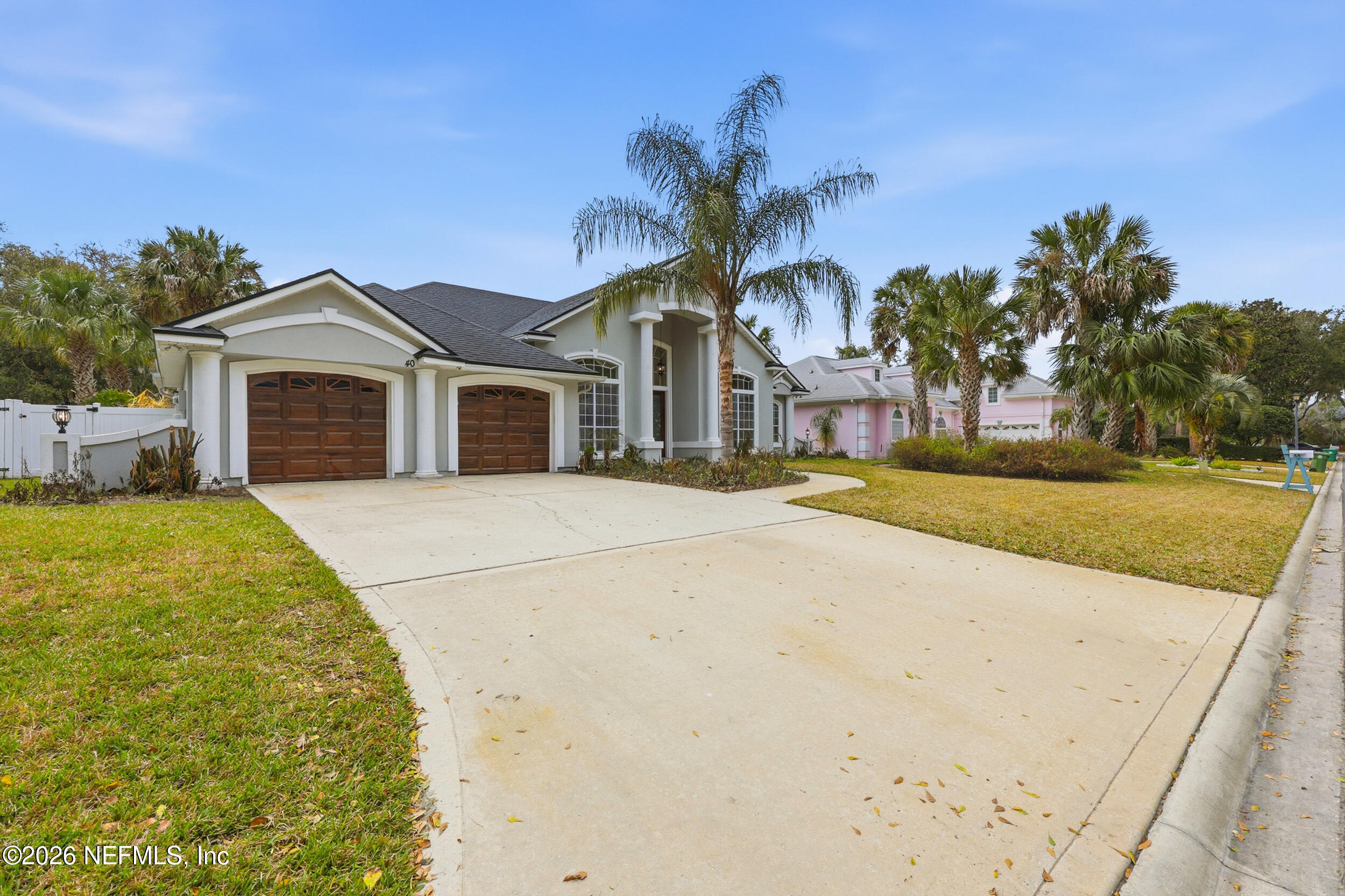 40 Tallwood Road Jacksonville Beach, FL 32250 - Photo 64 of 75 a front view of a house with a garden
