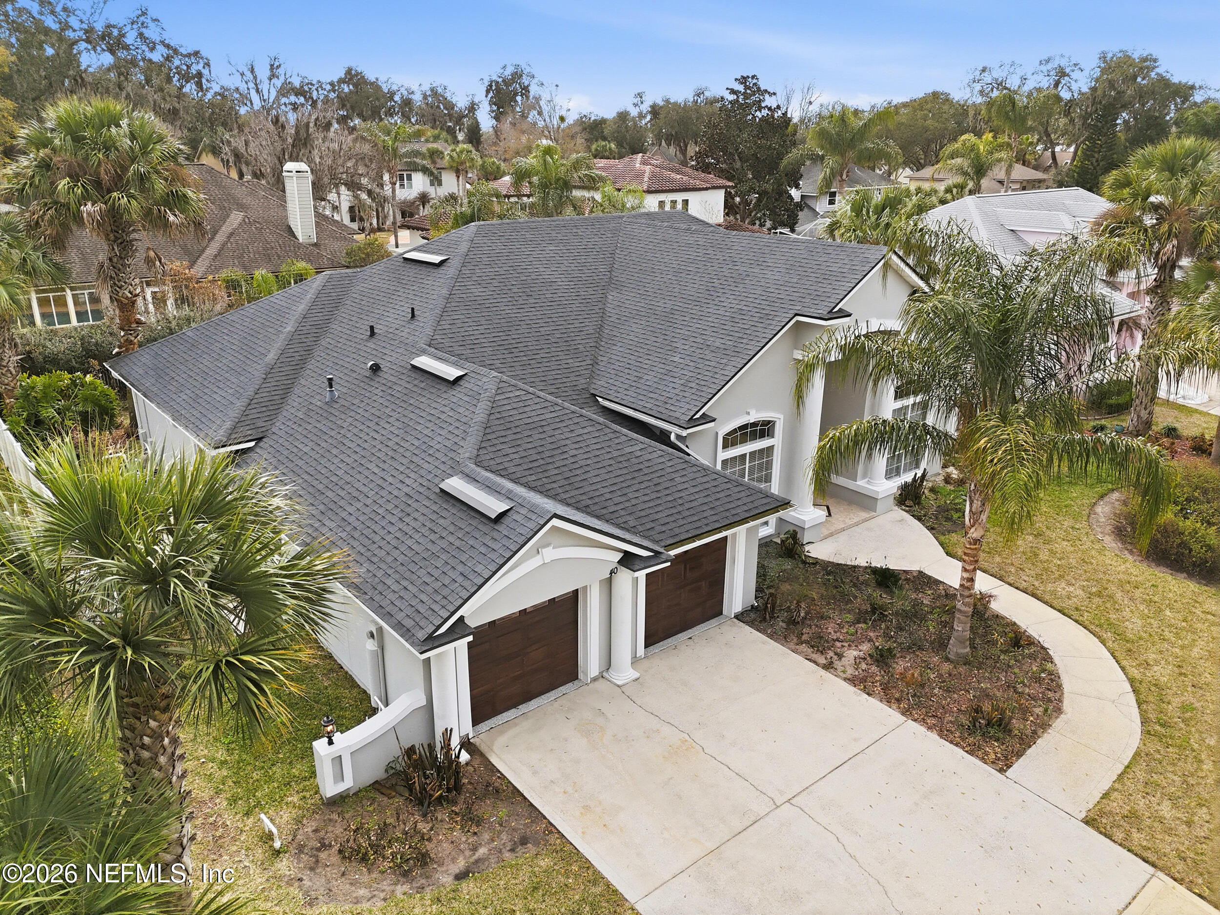 40 Tallwood Road Jacksonville Beach, FL 32250 - Photo 65 of 75 an aerial view of a house with a yard