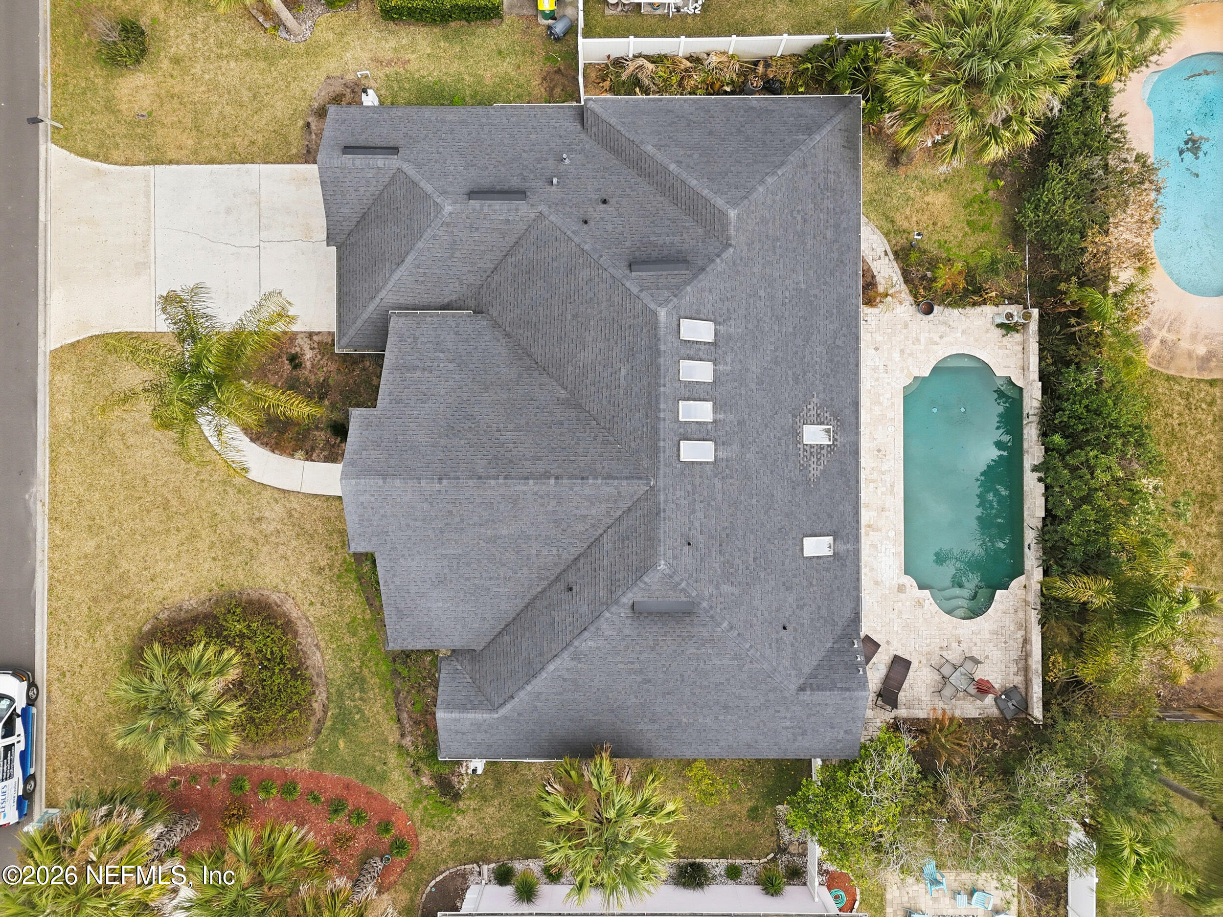 40 Tallwood Road Jacksonville Beach, FL 32250 - Photo 71 of 75 an aerial view of a house with a yard and large tree