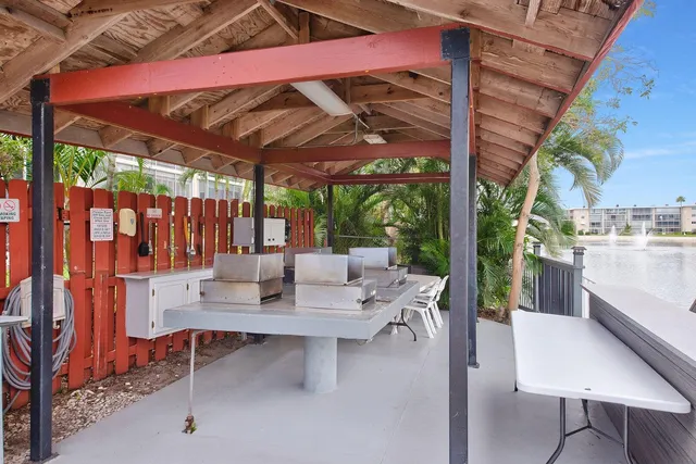 a view of an outdoor dining space with a patio