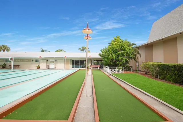 a view of house with a swimming pool