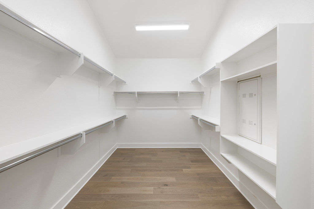 7321 Annette Cove Austin, TX 78724 - Photo 29 of 40 a view of a room with wooden floor and white walls