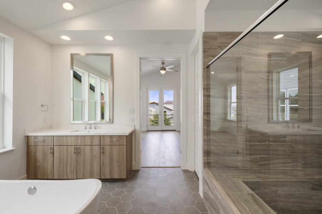 7321 Annette Cove Austin, TX 78724 - Photo 31 of 40 a bathroom with a tub shower and sink