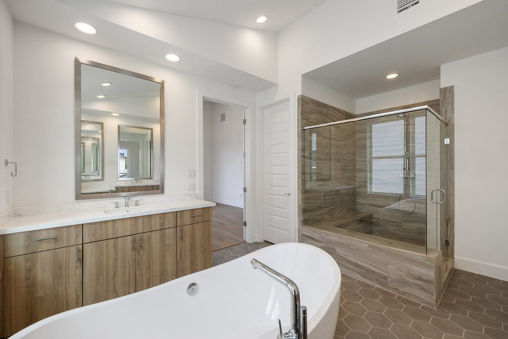 7321 Annette Cove Austin, TX 78724 - Photo 33 of 40 a bathroom with a sink a toilet a mirror and shower