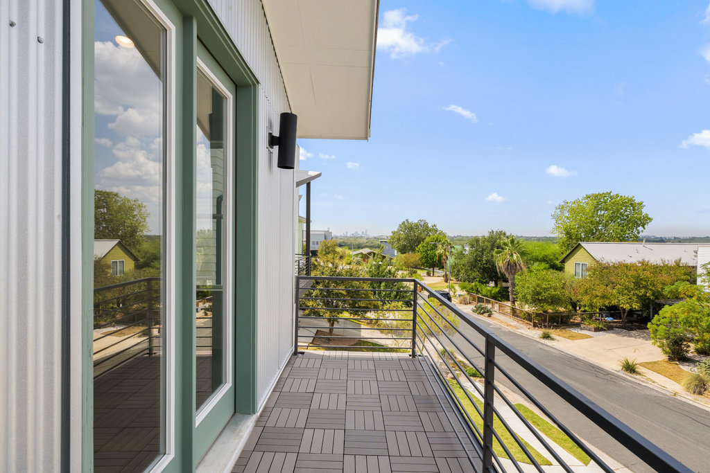 7321 Annette Cove Austin, TX 78724 - Photo 9 of 40 Enjoy sunset views over downtown Austin from your private balcony.