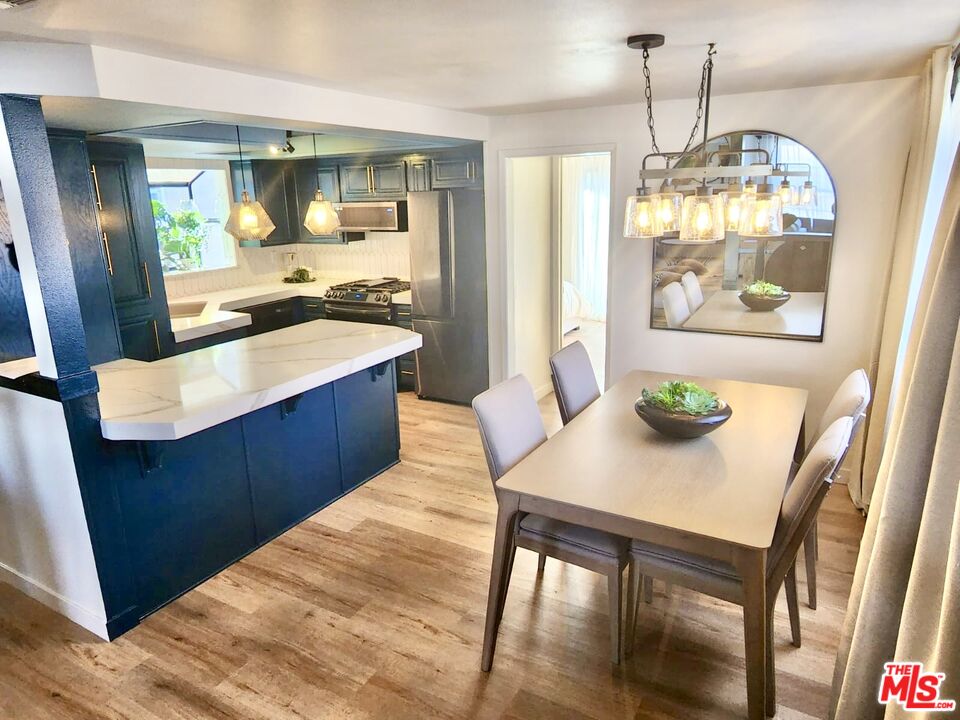 336 Highland Drive Oxnard, CA 93035 - Photo 12 of 25 a kitchen with a table and chairs