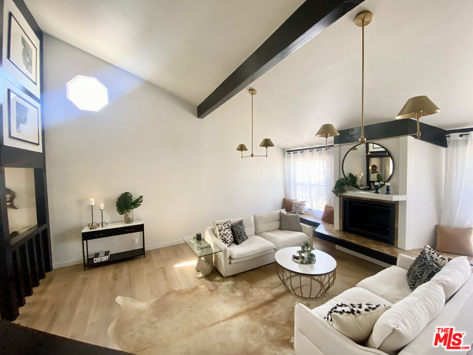 336 Highland Drive Oxnard, CA 93035 - Photo 2 of 25 a living room with furniture and a fireplace