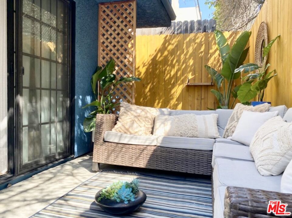 336 Highland Drive Oxnard, CA 93035 - Photo 21 of 25 a living room with a couch and a potted plant