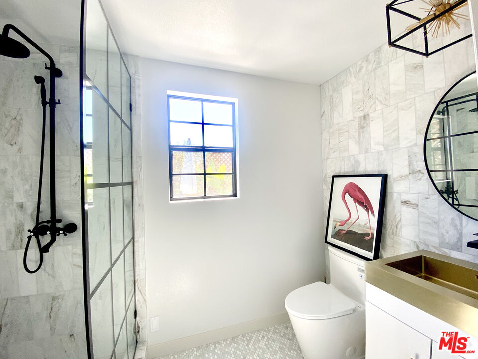 336 Highland Drive Oxnard, CA 93035 - Photo 6 of 25 a bathroom with a toilet sink and mirror